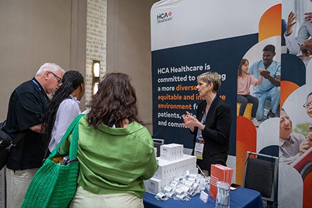 Accelerating Health Equity Conference - Exhibitors talking with conference attendees