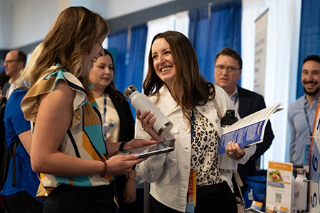 Accelerating Health Equity Conference - Exhibitors talking with conference attendees