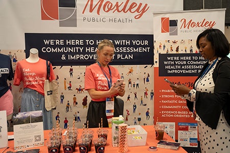 Accelerating Health Equity Conference - Exhibitors talking with conference attendees