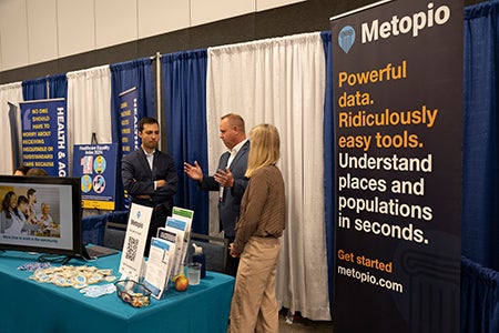 Accelerating Health Equity Conference - Exhibitors talking with conference attendees